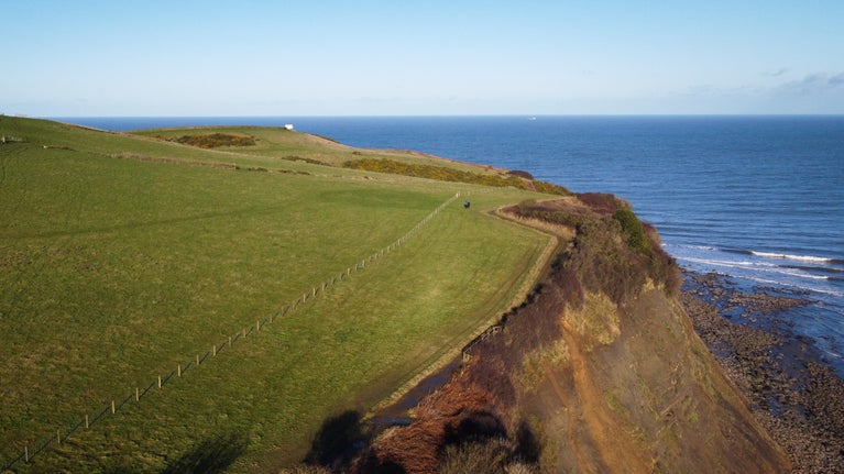 Aerial shot showing new fence line of Cleveland Way at Robin Hood's Bay